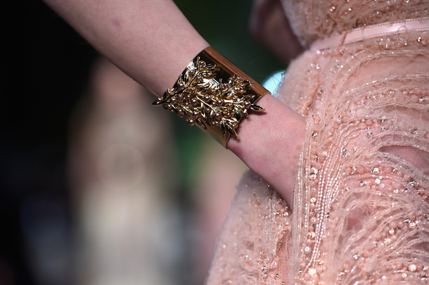 PARIS, FRANCE - JANUARY 28: A bracelet detail is seen as a model walks the runway during the Elie Saab show as part of Paris Fashion Week Haute Couture Spring/Summer 2015 on January 28, 2015 in Paris, France. (Photo by Pascal Le Segretain/Getty Images)